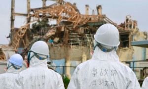 Investogators inspect the damaged building housing the No.3 reactor at TEPCO's Fukushima Dai-ichi nuclear power plant on June 17, 2011. Photograph: Kyodo/Reuters