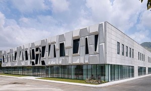 Gorgeous Geometric Facade Crowns Solar-Powered Office in Italy